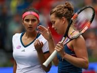 WUHAN, CHINA - OCTOBER 01:  Sania Mirza of India and Barbora Strycova of Czech Republic in action against Lucie Safarova of Czech Republic and Bethanie Mattek-Sands of United States during the double final match of 2016 Dongfeng Motor Wuhan Open at Optics Valley International Tennis Center on October 1, 2016 in Wuhan, China.  (Photo by Kevin Lee/Getty Images)